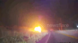 Officer, Bystanders Rescue Trapped Driver From Burning Vehicle