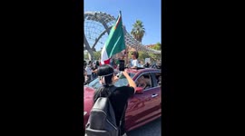 Protesters wave Mexican flags amid anger at ICE raids