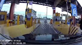 Faulty toll booth barrier slams onto woman's car as she drives through