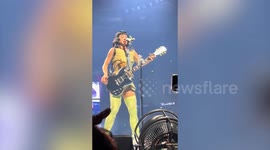 Fan storms stage and grabs Katy Perry by the shoulder during Sydney concert