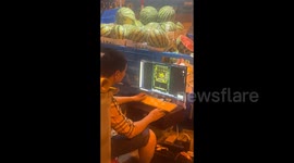 Man Sells Watermelons on Street While Drafting CAD Designs on His Laptop