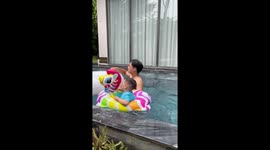 Child flips over in inflatable during family swim in Hanoi, Vietnam