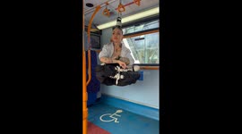 Girl Hanging on Her Hair on a Bus