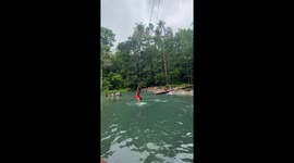 Rope swing over lagoon fails when tourist drags guide into water