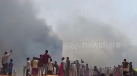 Air India plane crash site sparks thick clouds of smoke