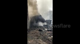 Firefighters Extinguish Wreckage of Crashed Air India Plane