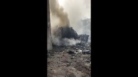 Smoke rises from Air India plane crash wreckage