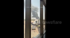 India: Smoke Coming From Site Of London-Bound Passenger Plane Crash / 2