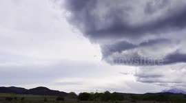 Heavy rain looms under dark clouds in Walsenburg, Colorado