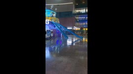Man slides past landing and into building on rainy day in Shandong, China