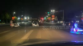 Dashcam captures quirky moment as men ride colorful children’s toy in Henan, China