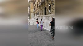 Activists hurl bank notes in protest at lack of funds in Italy