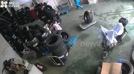 Stacked tyres topple onto toddler in car repair shop