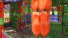 Recycled plastic bottles used for fences, floors and walls at Buddhist temple