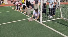 Girl impresses with fast wooden board race during school event in Inner Mongolia, China