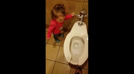 Baby discovers flushing hillariously
