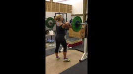 Pregnant woman doing some impressive weight lifting at the gym