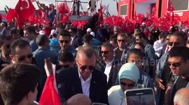 President of Turkey greets supporters at rally