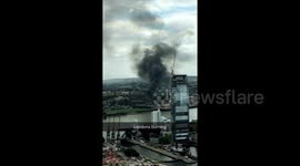 Smoke rises over Greenwich during nightclub fire