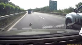 Pickup truck driver throws can to provoke a car on motorway