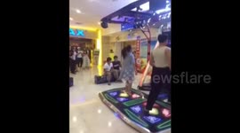 Girl's underwear drops out when she is dancing