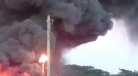 Fire burns live electric cable sparks and bangs raw footage st erth tyre factory fire