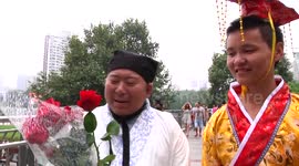 Man in imperial robe tries to find a girlfriend on street on Chinese Valentine’s Day