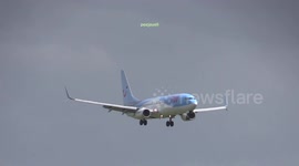 Plane bounces as it lands on a windy day at Amsterdam Airport