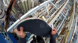 Daredevil skateboarder balances on edge of skyscraper in Hong Kong