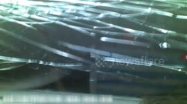 Car bonnet flies up and smashes windscreen while car's driving, causing crash