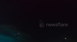 Northern Israel: Ballistic missiles from Iran enter the atmosphere while anti-missile missiles shot towards them.