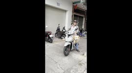 Golden Retriever and Smiling Man in Urban Vietnam Moment
