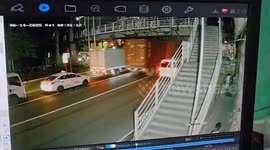 Truck crashes into low bridge knocking container onto car travelling behind