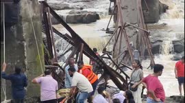 Bridge with dozens of tourists on collapses in India killing six