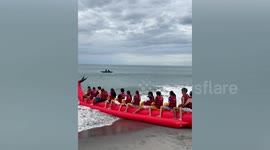 Inflatable dragon ride capsizes when it hits unexpectedly large wave