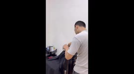 Cat is the purr-fect customer sitting still while having hair cut