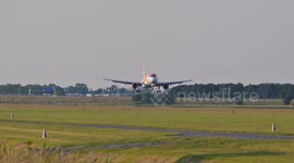 An Airbus A319 of EasyJet landing at Amstedam Schiphol airport