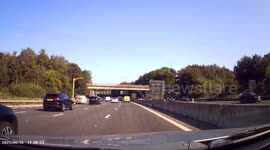 DASHCAM - Motorcyclist aggressively undertakes and pulls in front in VERY narrow gap on M27 Eastbound.