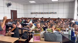 Musicians rehearse traditional Chinese orchestra piece