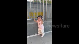 Crying little girl began to dance joyfully when she heard the music.