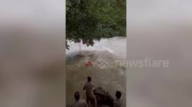 Strong water currents sweeps away youth, clings to tree trunk before dramatic rescue
