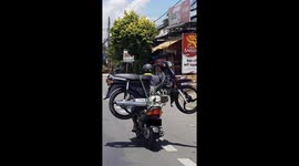 Man on Scooter Transporting Full-Size Scooter in Vietnam - On his Scooter ! Must see !