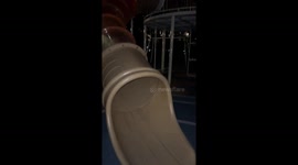 Dog slips at the end of slide before grabbing frisbee in Zhejiang, China