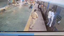 Railway Protection force saved a woman from falling under a moving train at Motihari railway station, Northern India
