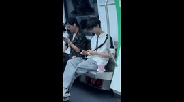 Man solves Rubik's Cube while looking at phone in Zhejiang, China
