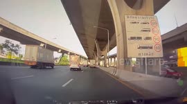 Truck part comes loose and cracks windscreen of car behind