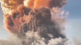 Ash cloud towers above homes following Mount Lewotobi volcano eruption