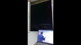 Missiles seen in skyline during online lesson in Amman, Jordan