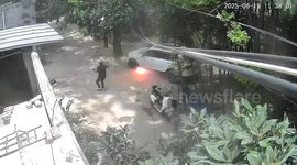 A female driver reversed over an electric wire, causing sparks to fly from under the car.