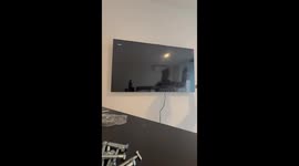 TV mounting mishap ends with laughter in Buenos Aires, Argentina